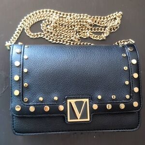 Black purse with gold colored hardware